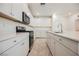 Well-equipped kitchen showcasing modern appliances and sleek white cabinetry at 3270 Trabia Ave, Henderson, NV 89044