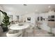 Open-concept living space featuring dining area, kitchen and living room with plant at 3270 Trabia Ave, Henderson, NV 89044