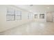 Bright living room showcasing tile floors and large windows with stylish blinds at 3270 Trabia Ave, Henderson, NV 89044