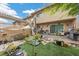 Backyard with a brick patio, an awning and stone landscaping, ideal for outdoor relaxation at 3363 Pavlo St, Las Vegas, NV 89121