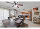 Dining room with wood table set, tile flooring, and view into kitchen area at 3363 Pavlo St, Las Vegas, NV 89121