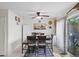 Bright dining room with a wood table set, decorative accents, and a sliding glass door at 3363 Pavlo St, Las Vegas, NV 89121