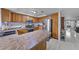 Well-appointed kitchen with wooden cabinets, stainless steel appliances, and bar countertop at 3363 Pavlo St, Las Vegas, NV 89121