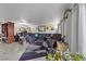 Spacious living room with a large sectional sofa, decor, and natural light at 3363 Pavlo St, Las Vegas, NV 89121