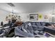 Spacious living room with a comfortable sectional sofa, large TV, and decor at 3363 Pavlo St, Las Vegas, NV 89121