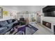 Bright and airy living room with a large sofa, fireplace, and natural light at 3363 Pavlo St, Las Vegas, NV 89121