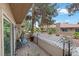 Relaxing patio area with seating, brick flooring, and views of the lush landscaping at 3363 Pavlo St, Las Vegas, NV 89121