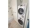 Bathroom featuring in-unit, stacked washer and dryer, tub and shower combo with safety bars at 3606 Di Salvo Dr # 133, Las Vegas, NV 89103