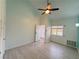 Spacious bedroom with wood-look tile flooring, fan, and neutral paint scheme at 3606 Di Salvo Dr # 133, Las Vegas, NV 89103