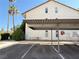Exterior view of the building's parking, showing assigned parking spaces and carports for units 133 & 134 at 3606 Di Salvo Dr # 133, Las Vegas, NV 89103