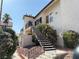 An apartment building with outdoor stairs and lovely landscaping at 3606 Di Salvo Dr # 133, Las Vegas, NV 89103