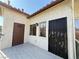 Charming exterior featuring stucco walls, a covered entryway, and security doors on the front door and windows at 3606 Di Salvo Dr # 133, Las Vegas, NV 89103