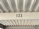 Closeup of the assigned parking space marked 133 with metal covering at 3606 Di Salvo Dr # 133, Las Vegas, NV 89103