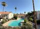 Community pool surrounded by lush tropical landscaping at 3606 Di Salvo Dr # 133, Las Vegas, NV 89103