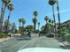 Palm tree lined street leads to gated entrance at 3606 Di Salvo Dr # 133, Las Vegas, NV 89103
