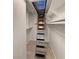 Walk-in closet featuring custom built-in shelving and drawers, accessible via a ceiling ladder at 3606 Di Salvo Dr # 133, Las Vegas, NV 89103
