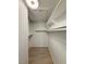 Walk-in closet with built-in shelves and wood-look tile flooring at 3606 Di Salvo Dr # 133, Las Vegas, NV 89103