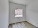 Small bedroom showcasing light and neutral walls and gray-tone wood flooring at 365 N 16Th St, Las Vegas, NV 89101