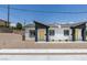 Stylish home featuring a minimalist desert landscape, xeriscaping and a welcoming facade at 365 N 16Th St, Las Vegas, NV 89101