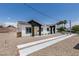 Well-kept home showcasing a desert landscape, long driveways, and a welcoming facade at 365 N 16Th St, Las Vegas, NV 89101