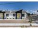 Charming single-story home with a modern design, yellow front door, and well-maintained landscaping at 365 N 16Th St, Las Vegas, NV 89101
