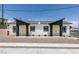 Charming duplex featuring matching front doors, landscaped yard and a modern exterior color palette at 367 N 16Th St, Las Vegas, NV 89101