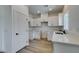 Bright kitchen with white cabinets, quartz countertops and new flooring at 367 N 16Th St, Las Vegas, NV 89101