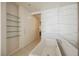 Clean bathroom featuring a built-in tub, shelving, and minimalist design perfect for relaxation at 3726 Las Vegas Blvd # 704, Las Vegas, NV 89158