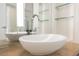 Modern bathroom featuring dual vessel sinks, a sleek faucet, and glass shelving for a contemporary design at 3726 Las Vegas Blvd # 704, Las Vegas, NV 89158