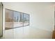 Bright bedroom with views of the city featuring tile floors and light filtering shades for privacy at 3726 Las Vegas Blvd # 704, Las Vegas, NV 89158