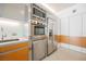 Modern kitchen featuring stainless steel appliances and white and wood cabinets at 3726 Las Vegas Blvd # 704, Las Vegas, NV 89158