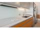 Modern kitchen with stainless steel appliances, white countertops, and wood cabinets at 3726 Las Vegas Blvd # 704, Las Vegas, NV 89158