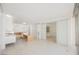Bright living room with a seamless connection to the kitchen and bathroom featuring tile floors and minimalist design at 3726 Las Vegas Blvd # 704, Las Vegas, NV 89158