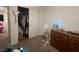 Bedroom with carpet floors, open closet, dresser, and overhead lighting at 4056 Campeche Ave, Las Vegas, NV 89121