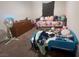 Bedroom featuring carpet floors, a twin bed with trundle, dresser, and overhead lighting at 4056 Campeche Ave, Las Vegas, NV 89121