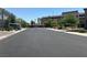 Quiet street view, featuring the community, a parkade, and a well-maintained road at 4056 Campeche Ave, Las Vegas, NV 89121