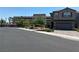 Street view of the neighborhood, showing the house, landscaping, and the parkade at 4056 Campeche Ave, Las Vegas, NV 89121