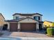 Charming two-story home with a three-car garage and a meticulously brick paved driveway at 4076 Topaz Hills Dr, North Las Vegas, NV 89032