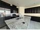 Modern kitchen with stainless steel appliances, granite counters, and ample cabinetry at 4076 Topaz Hills Dr, North Las Vegas, NV 89032