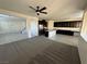 Open-concept living room flowing seamlessly into a modern kitchen and staircase at 4076 Topaz Hills Dr, North Las Vegas, NV 89032