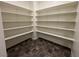 Spacious pantry with ample shelving for food storage and organization, complete with tiled flooring at 4076 Topaz Hills Dr, North Las Vegas, NV 89032