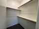 Walk-in closet with shelving and plush carpet at 4076 Topaz Hills Dr, North Las Vegas, NV 89032