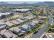 Expansive aerial view showcasing the neighborhood with its orderly layout and mountain views at 412 Gracious Way, Henderson, NV 89011