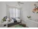 Charming bedroom with a cozy bed, window, closet, and a cute nightstand and dresser at 412 Gracious Way, Henderson, NV 89011