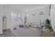 Bright bonus room features a play area, desk, and three sunny windows offering plentiful natural light at 412 Gracious Way, Henderson, NV 89011