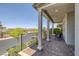 Inviting front porch features classic columns, and a charming sitting area at 412 Gracious Way, Henderson, NV 89011