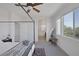 Bright main bedroom with a four-poster bed frame, view to the ensuite, and tasteful decor at 412 Gracious Way, Henderson, NV 89011