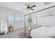 Sunlit main bedroom boasts a four-poster bed frame, ample natural light, and stylish decor accents at 412 Gracious Way, Henderson, NV 89011
