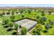 Overhead aerial shot of community tennis courts surrounded by green space and trees at 412 Gracious Way, Henderson, NV 89011
