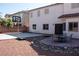 The backyard features a basketball court, patio set, rock landscaping, and a stucco wall at 4126 Jessica Marie St, North Las Vegas, NV 89032